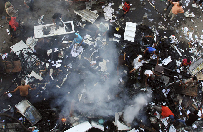 A scene of the
  aftermath of a fire that was set in the headquarters of the
  Freedom and Justice Party by anti-Morsi protesters during clashes
  between them and supporters of Egyptian president Mohamed Morsi
  in Sedy Gaber in Alexandria, June 28, 2013. (Reuters)